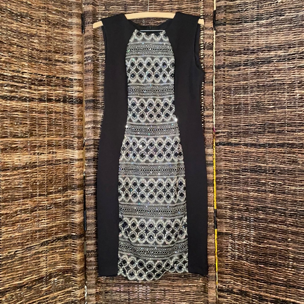 R & M Richards fitted little black dress. Size 6. Has stretch with poly/spandex.